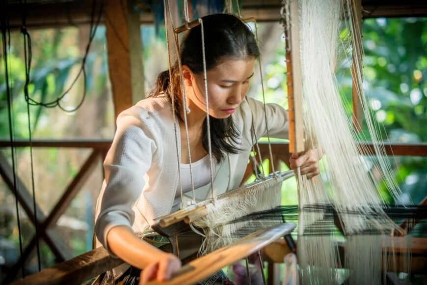 Locals doing traditional handicrafts in Luang Prabang