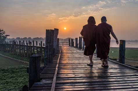 Take a short walk to in Taungthman Lake where it stands the world’s longest teakwood bridge – U Bein