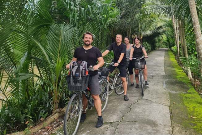 Cycling to explore the orchard in Mekong Delta Tour
