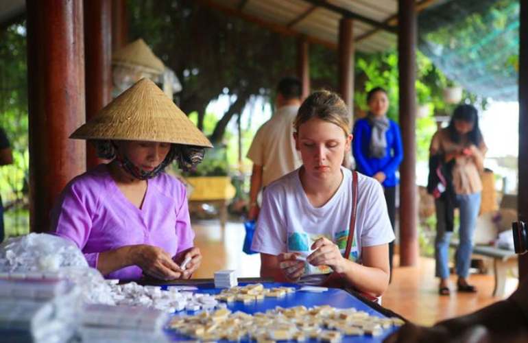 Visit a coconut candy factory in Mekong Delta